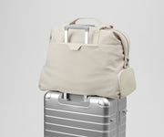 Transit Canvas Weekender on top of an Aluminum Away suitcase