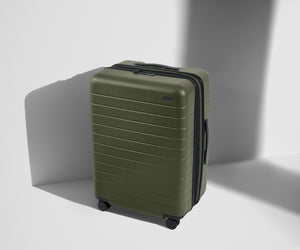Angled product view of The Medium Flex suitcase in Sea Green