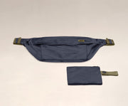 Packable Sling Bag laying flat and shown with the compact zip pouch to store when not in use