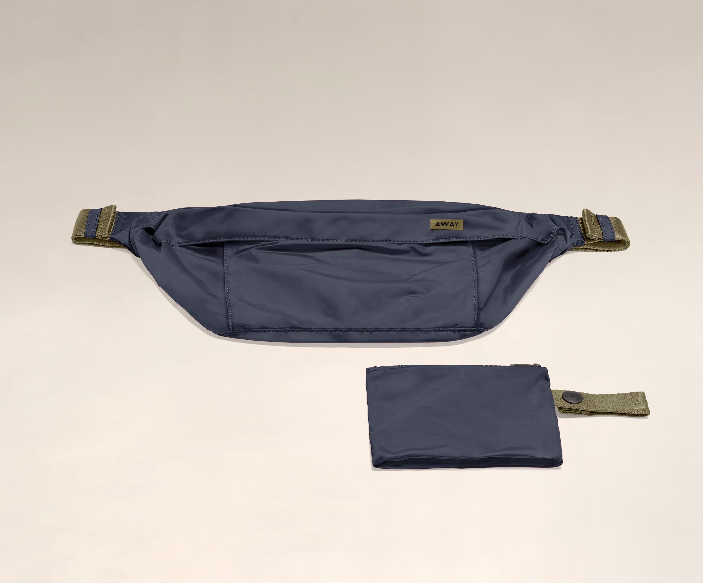 Packable Sling Bag laying flat and shown with the compact zip pouch to store when not in use