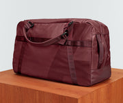 Angled view of the Active Duffle 70L on a plinth