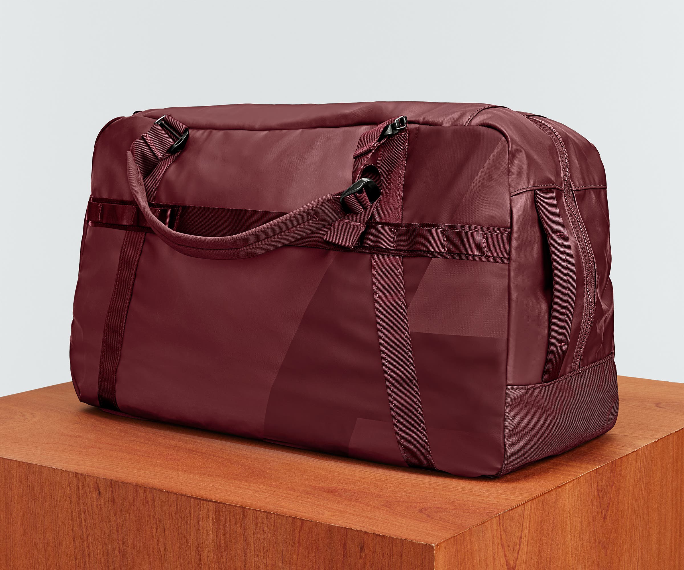 Angled view of the Active Duffle 70L on a plinth