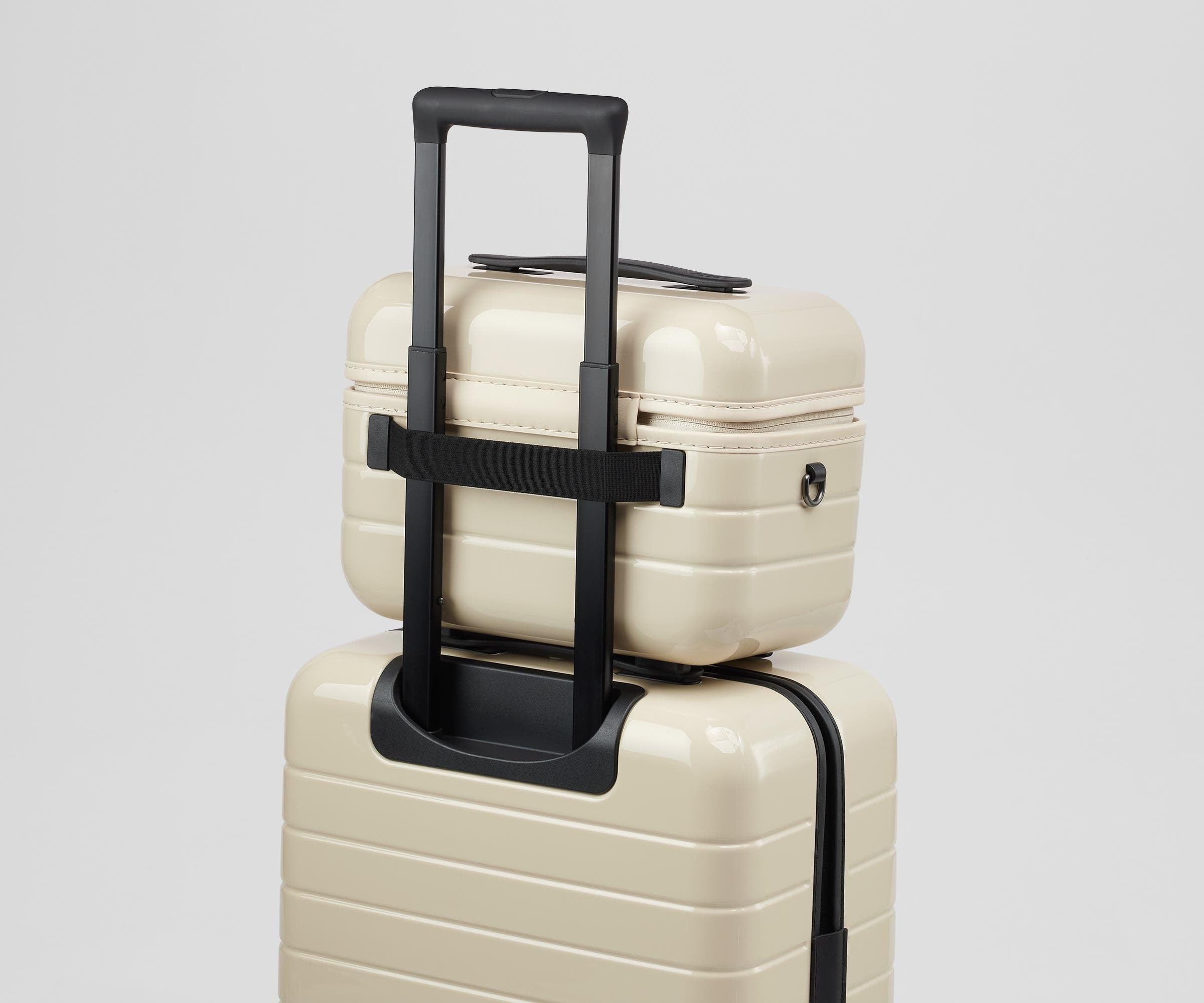 Train Case on top of an Away suitcase