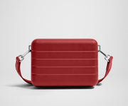 Unzipped, open view of The Mini Crossbody, showing the two main compartments and slip pocket