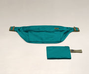Packable Sling Bag laying flat and shown with the compact zip pouch to store when not in use