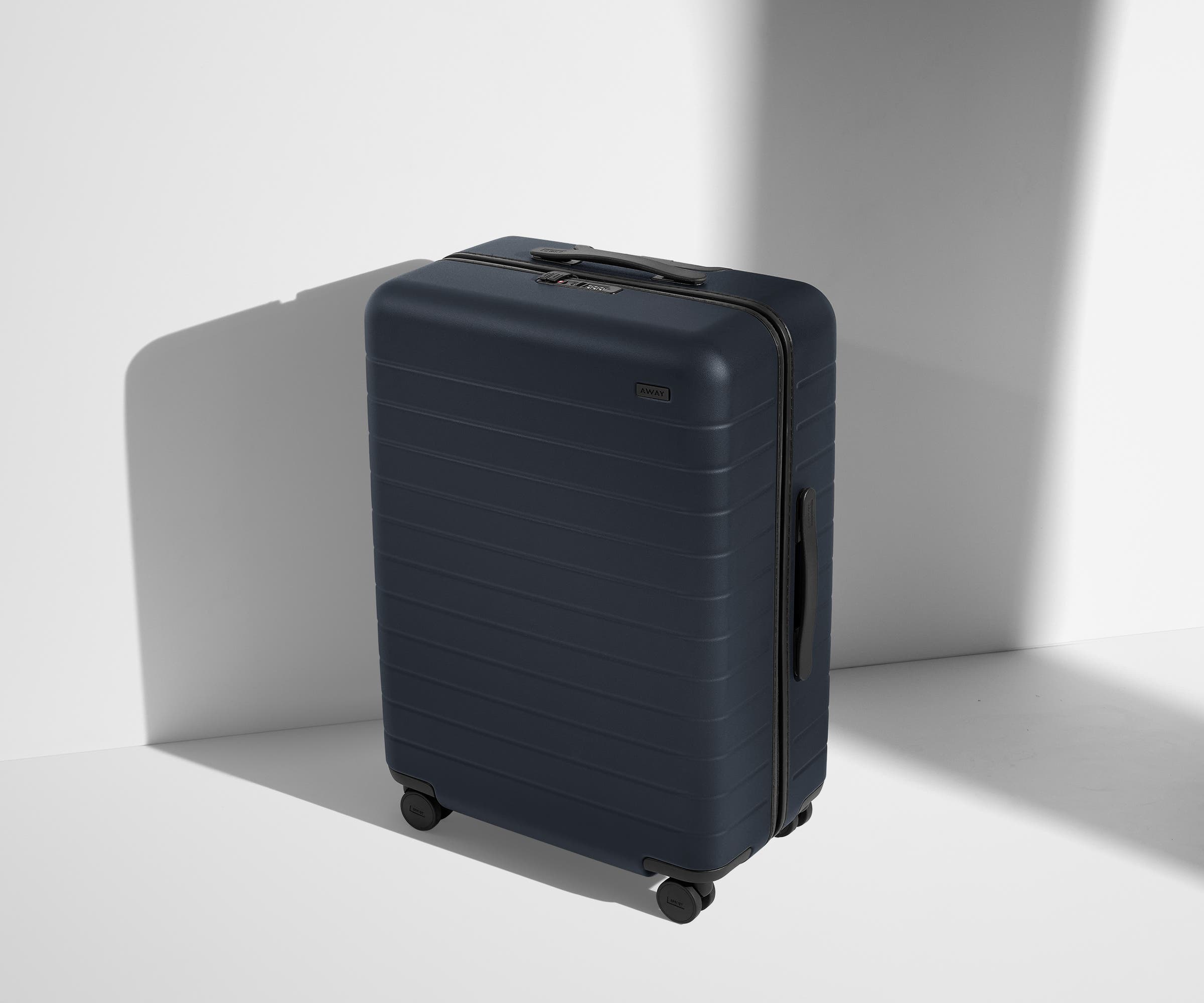 Angled product view of The Medium suitcase in Navy Blue