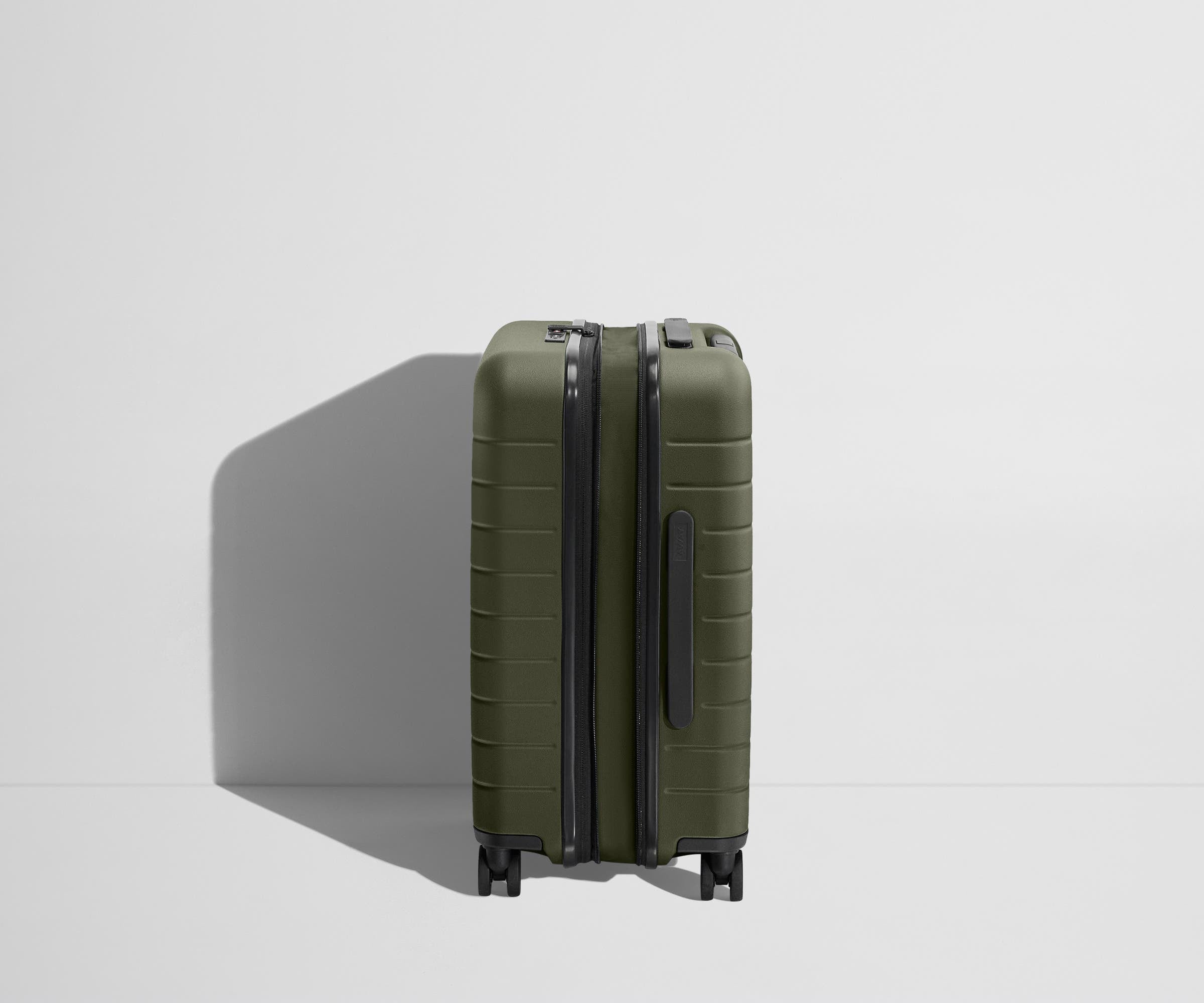 Side product view of The Carry-On Flex suitcase in Olive Green shown fully expanded