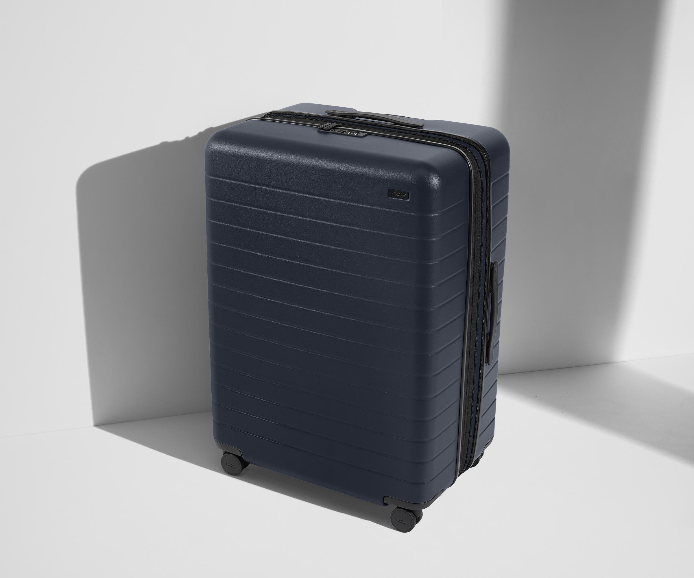 Angled product view of The Large Flex suitcase in Navy Blue