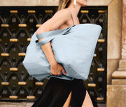 Person holding a Large Featherlight Tote in Arctic Blue