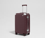 The Aluminum Edge Bigger Carry-On in Oxblood Red