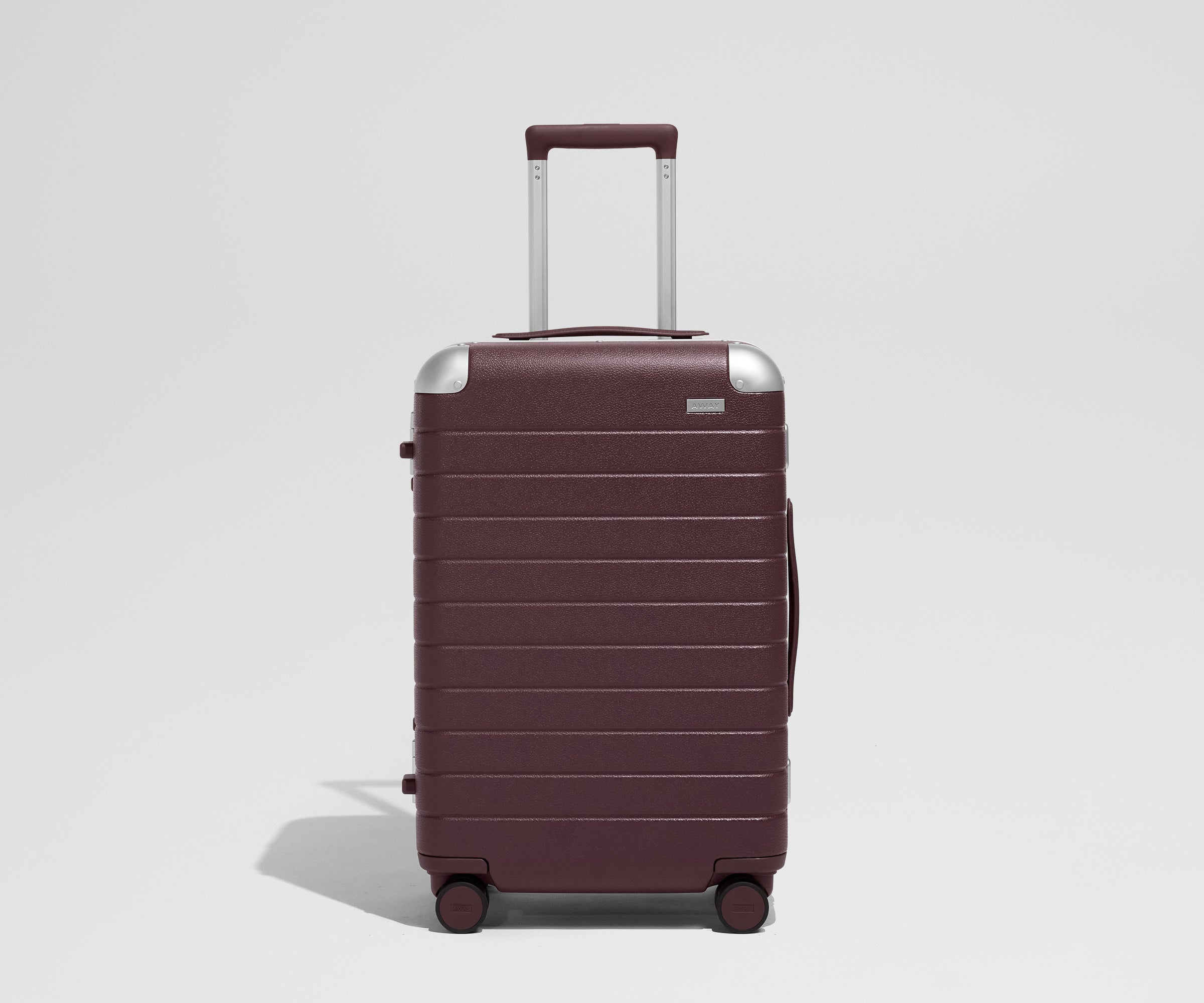 The Aluminum Edge Bigger Carry-On in Oxblood Red