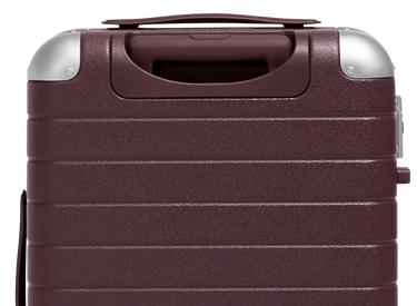 The Aluminum Edge Bigger Carry-On in Oxblood Red
