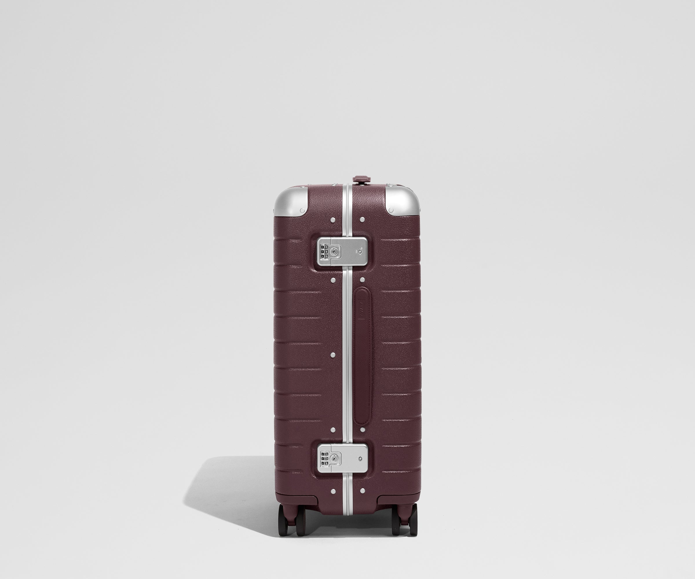 The Aluminum Edge Bigger Carry-On in Oxblood Red