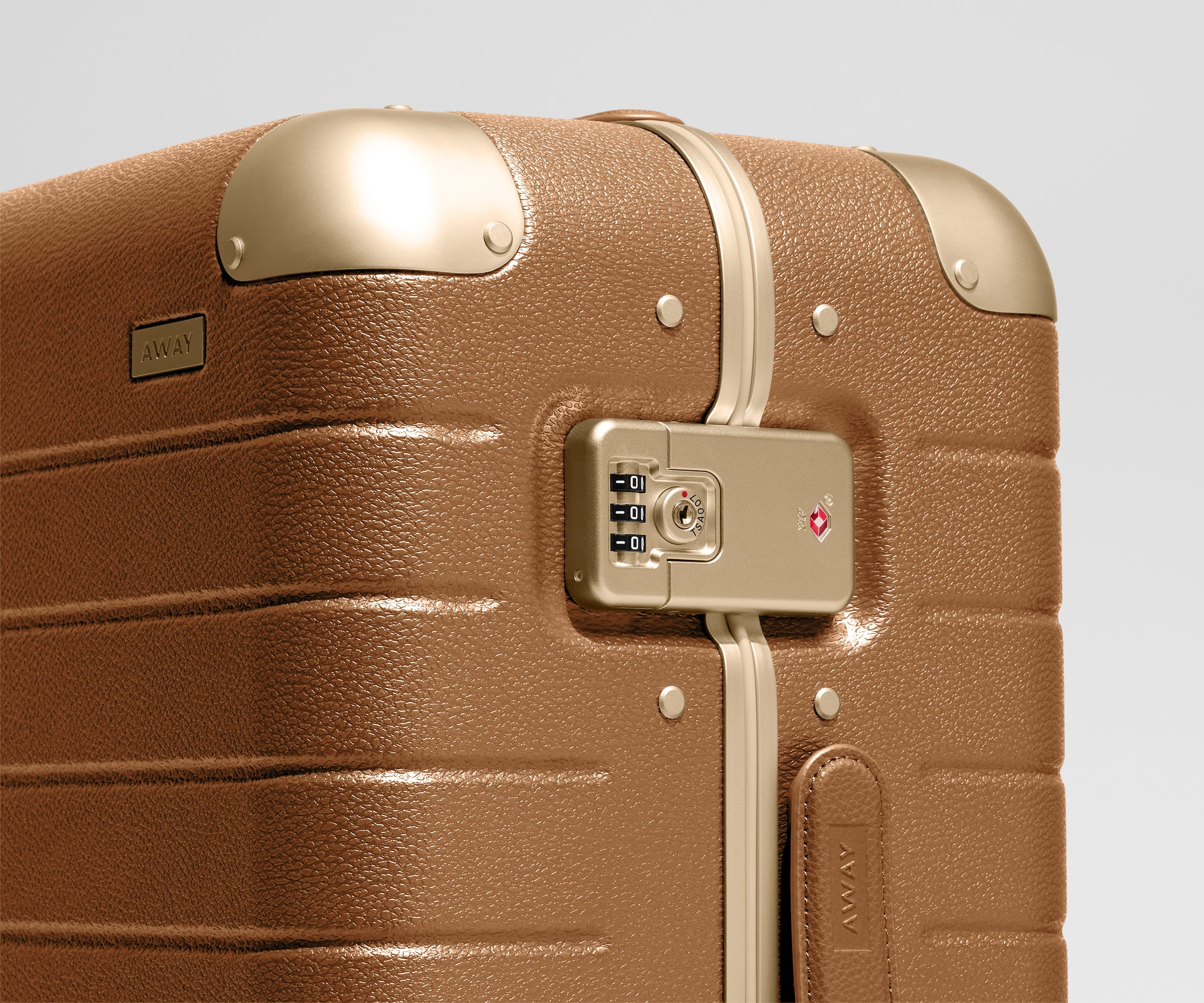 The Aluminum Edge Bigger Carry-On in Cognac Brown