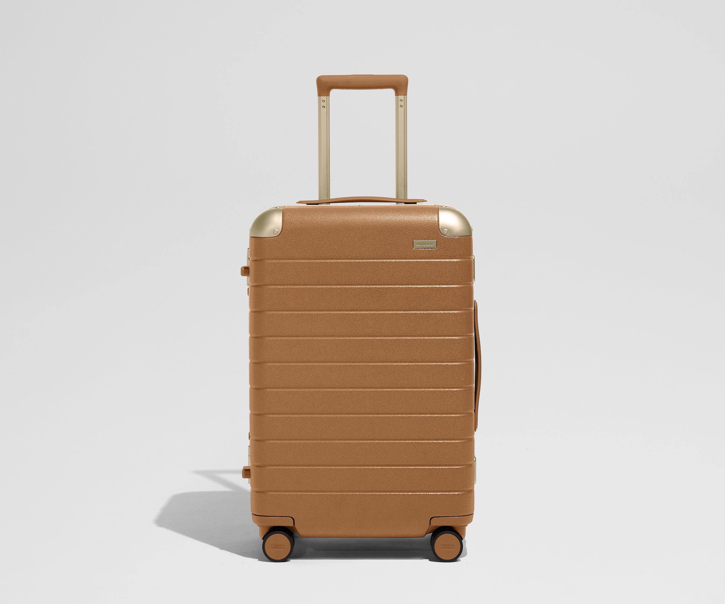 The Aluminum Edge Bigger Carry-On in Cognac Brown
