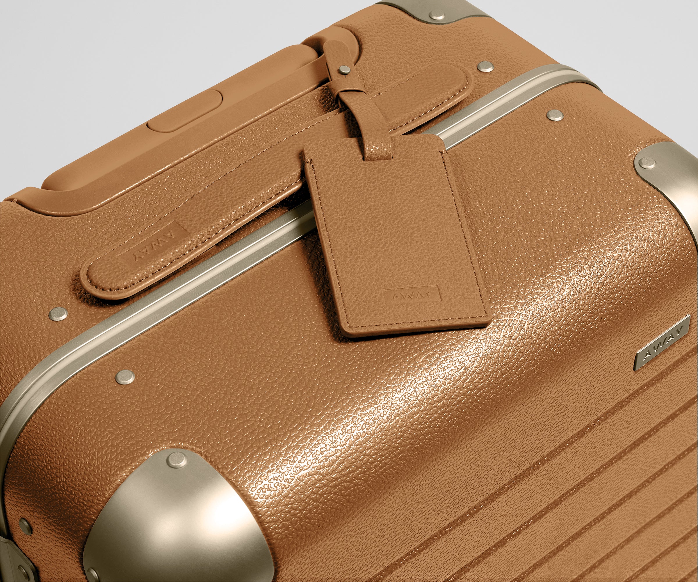 The Aluminum Edge Bigger Carry-On in Cognac Brown