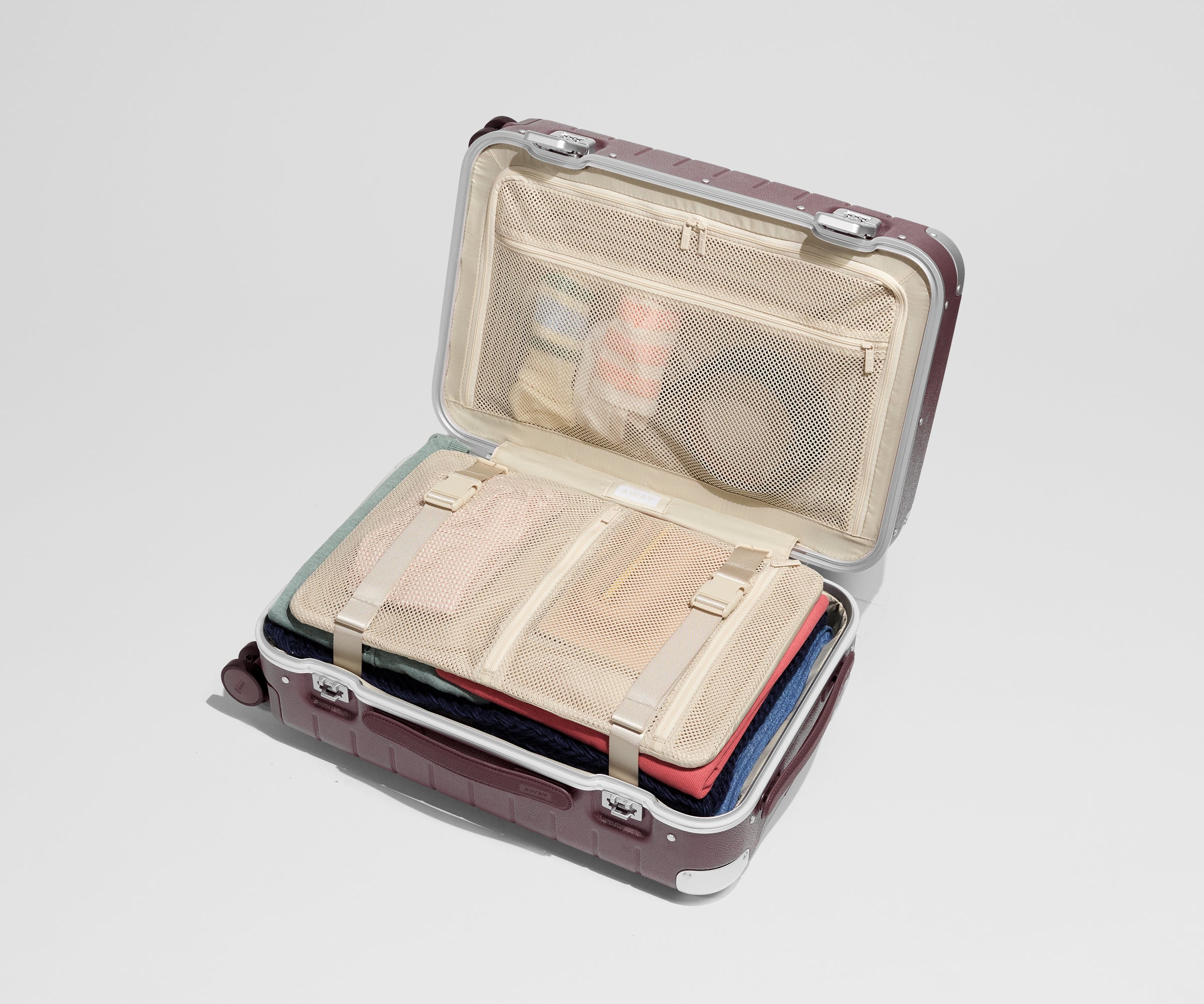 The Aluminum Edge Carry-On in Oxblood Red