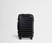 Back view of an Aluminum Bigger Carry-On suitcase in Onyx Black