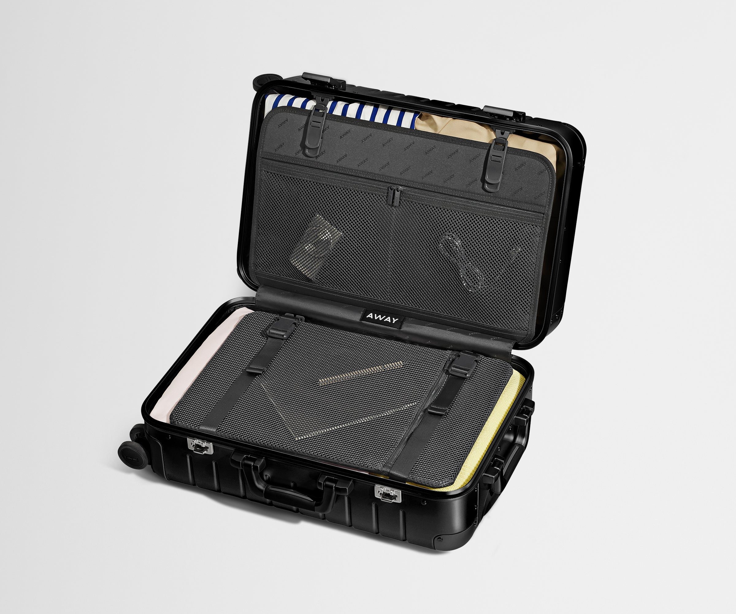 Packed view of an Aluminum Bigger Carry-On, showing the compression pad and interior organization