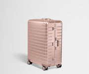 Angled product view of a Rose Gold Large aluminum suitcase