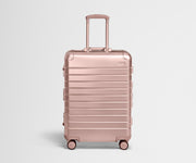 Front view of the Medium: Aluminum suitcase in Rose Gold with handles raised