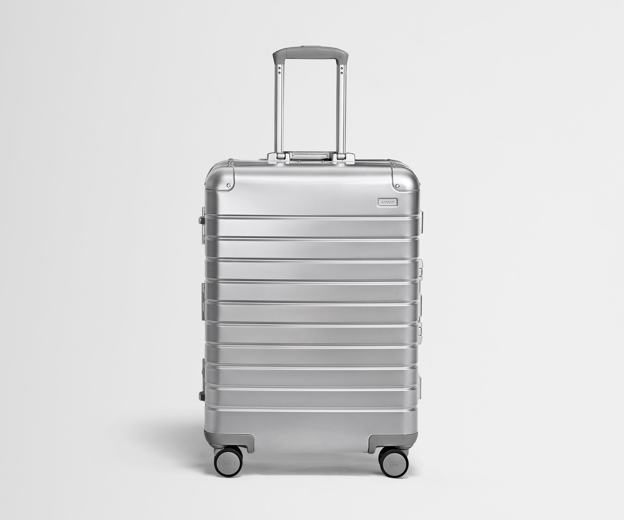 Front view of the Medium: Aluminum suitcase in Silver with handles raised