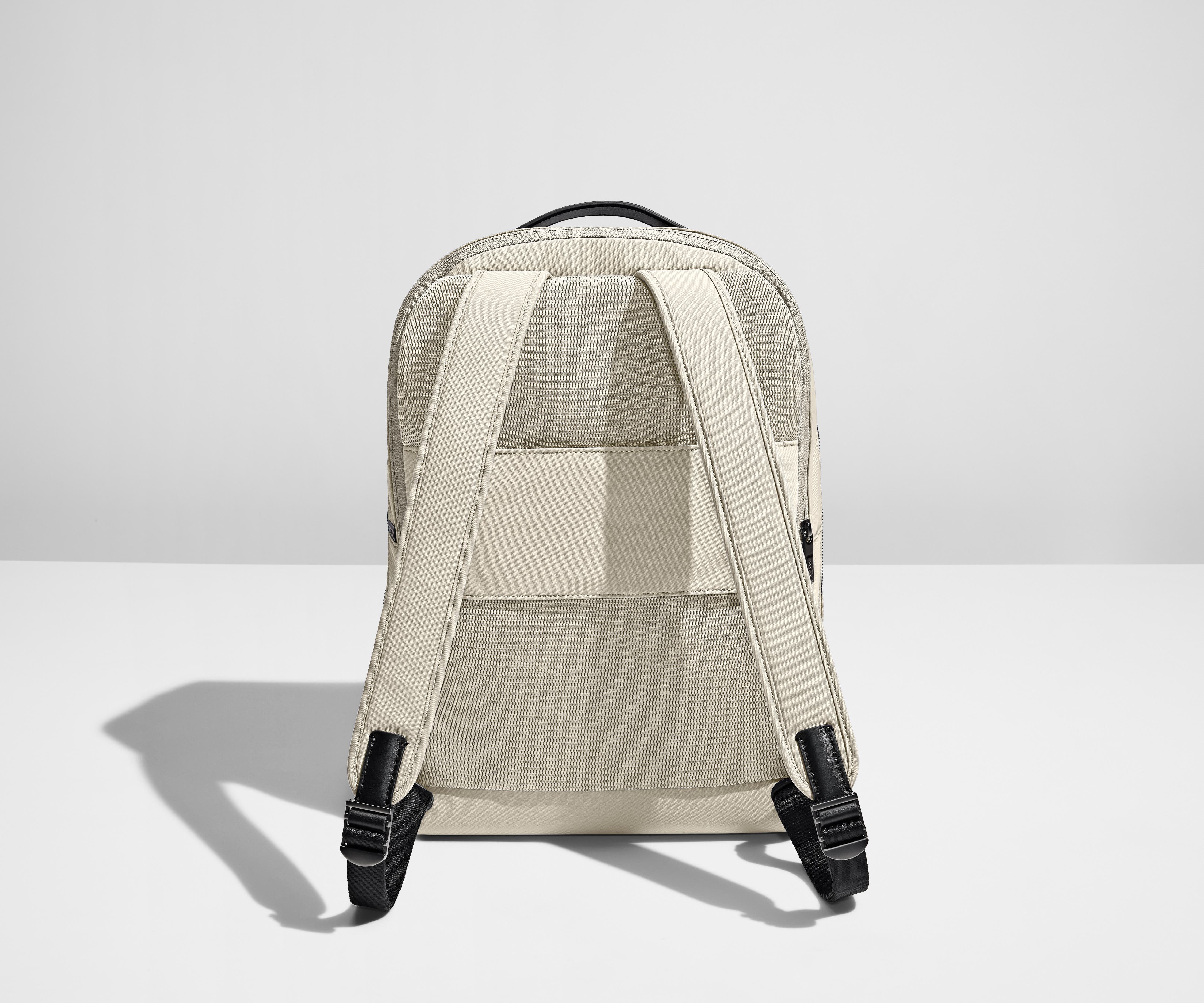Padded shoulder straps and trolley sleeve on the back of a Salt White Everywhere Zip Backpack
