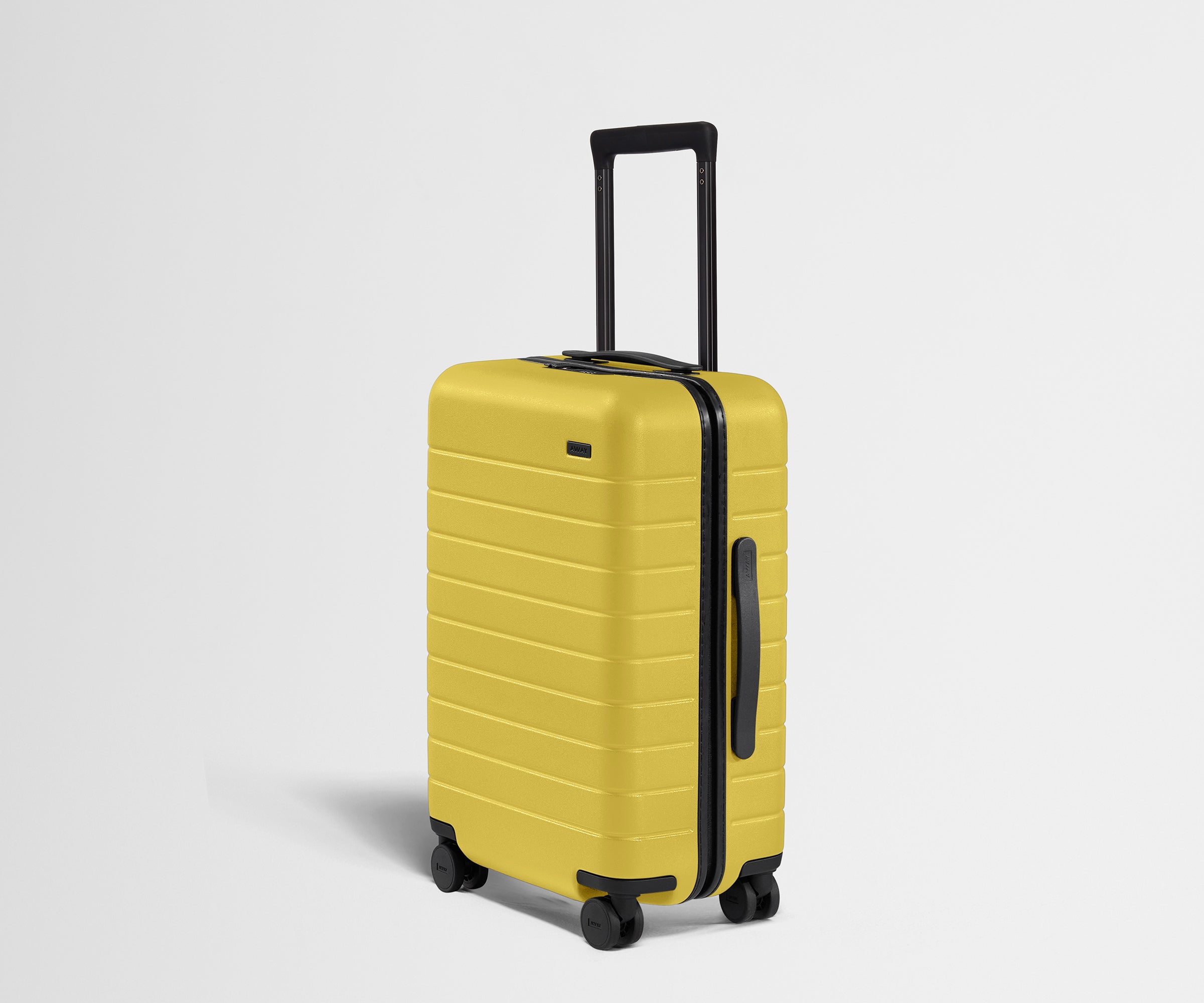 Angled product view of The Carry-On suitcase in Sunshine Yellow
