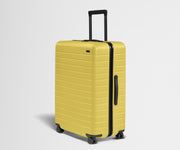 Angled product view of The Large suitcase in Sunshine Yellow