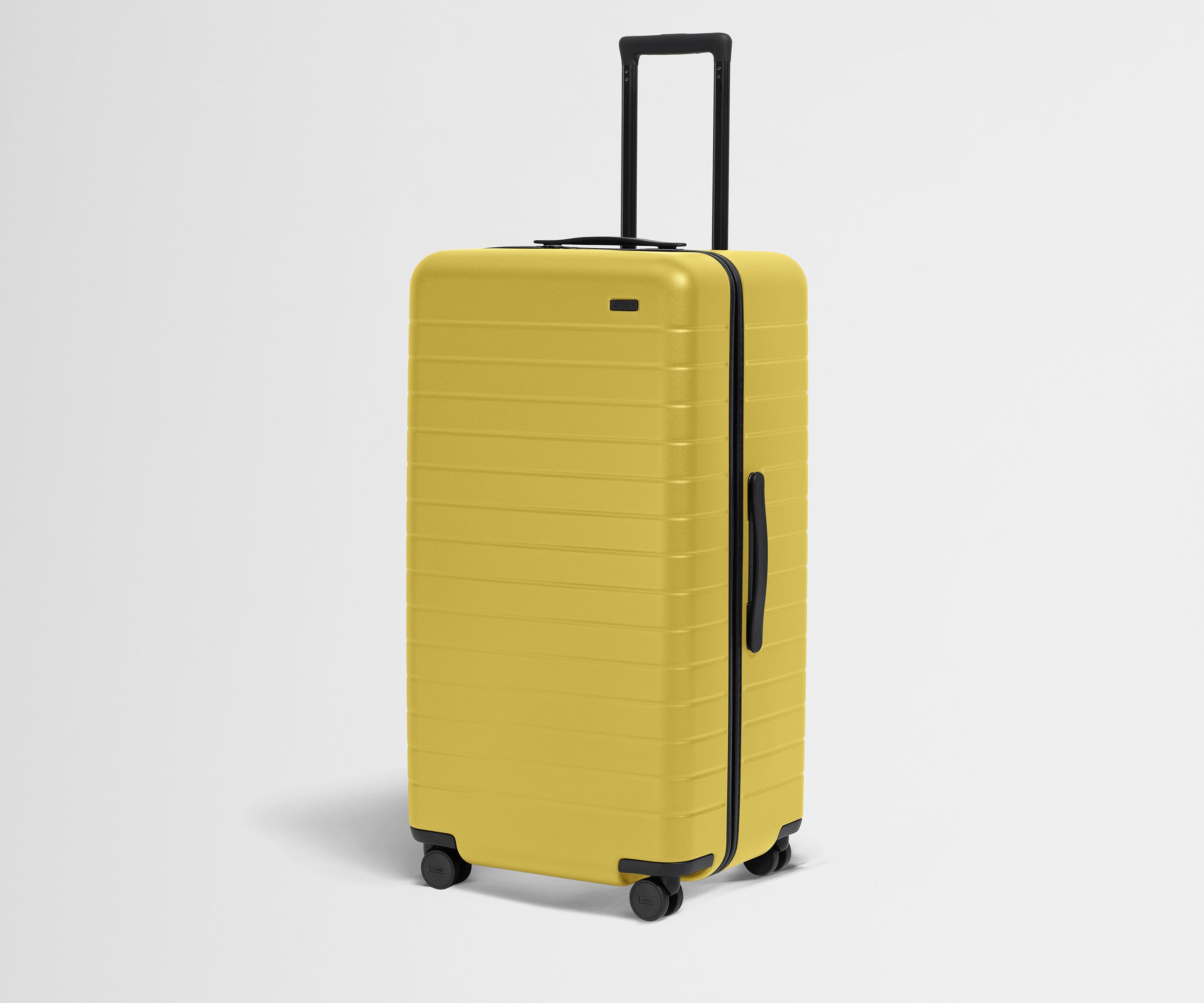 Angled product view of The Trunk suitcase in Sunshine Yellow