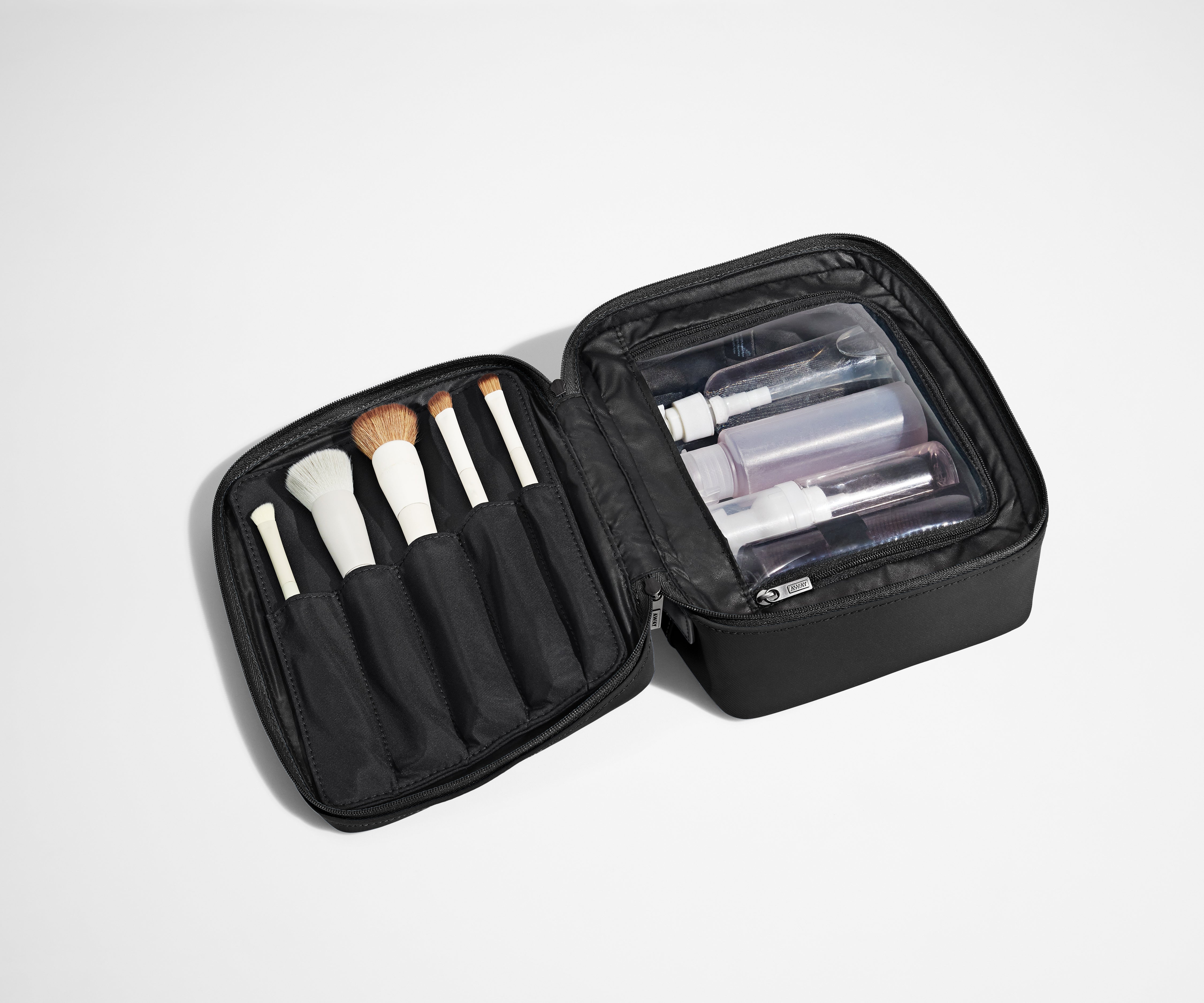 Cosmetics Bag packed with make up brushes and skincare