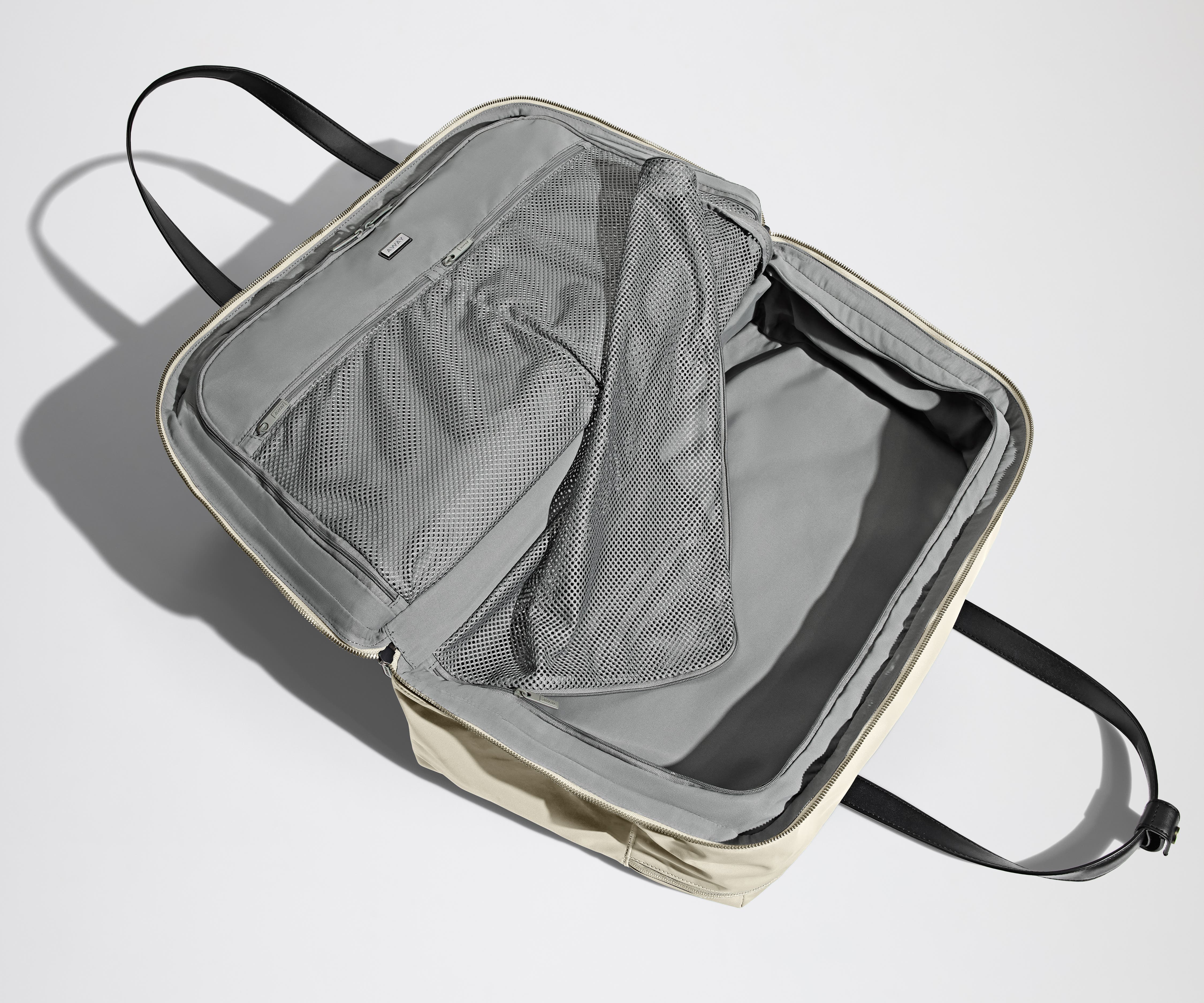 Open, unpacked Weekender Bag showing the mesh compartments and pockets