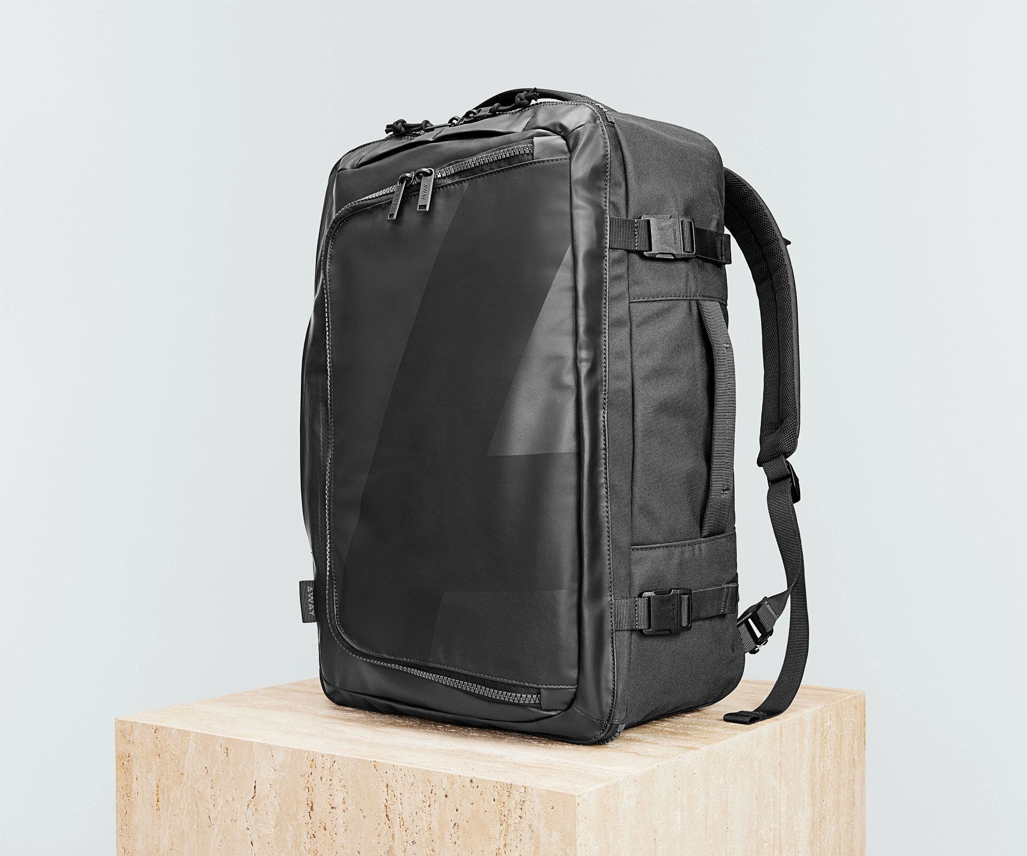 Angled view of the 45L Convertible Backpack, showing the compression straps and side grab handles