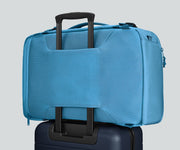 Active Convertible Backpack 45L secured to an Away suitcase by the luggage trolley sleeve