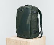 Angled view of the 45L Convertible Backpack, showing the compression straps and side grab handles