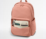 Phone, passport, and keys in their dedicated pockets in the front zip pocket