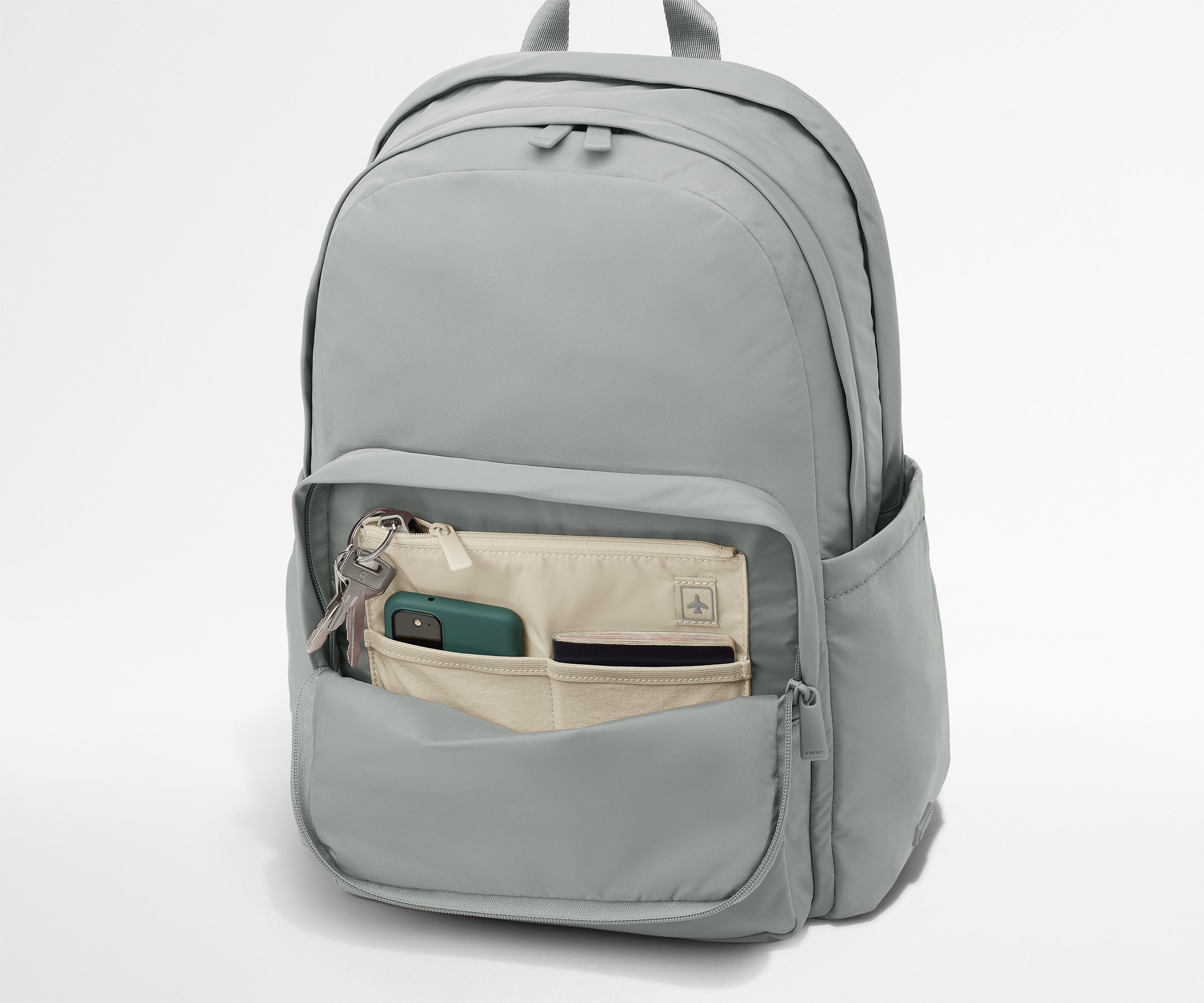 Gray backpack with front pocket on a white background