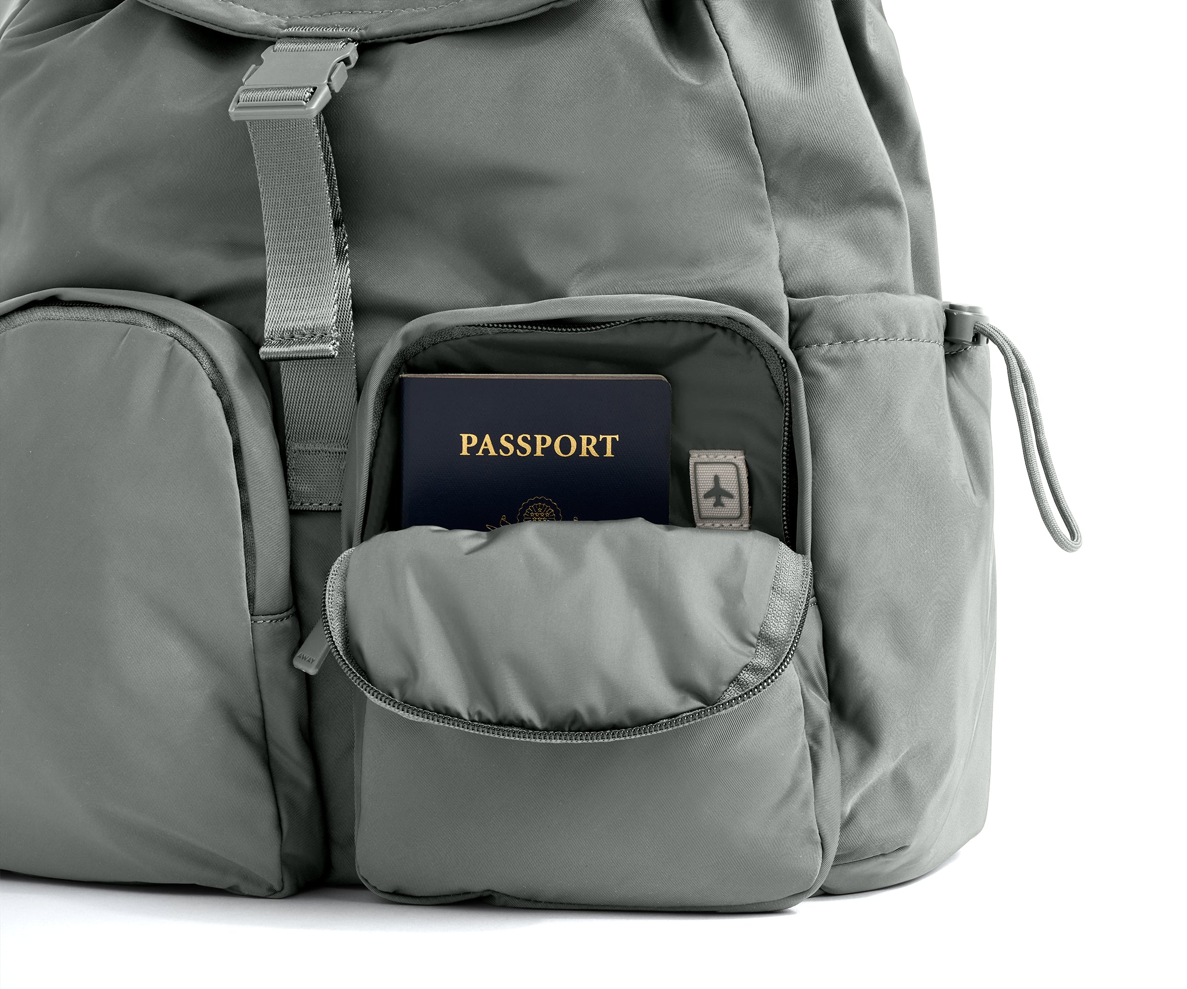 Gray backpack with a passport in an open pocket on a white background