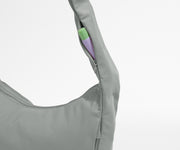 Gray sleeveless top with a pocket on a light gray background