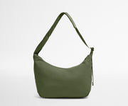 Green shoulder bag on a light gray background