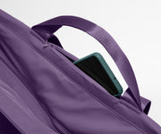 Phone shown in the hidden pocket between handles