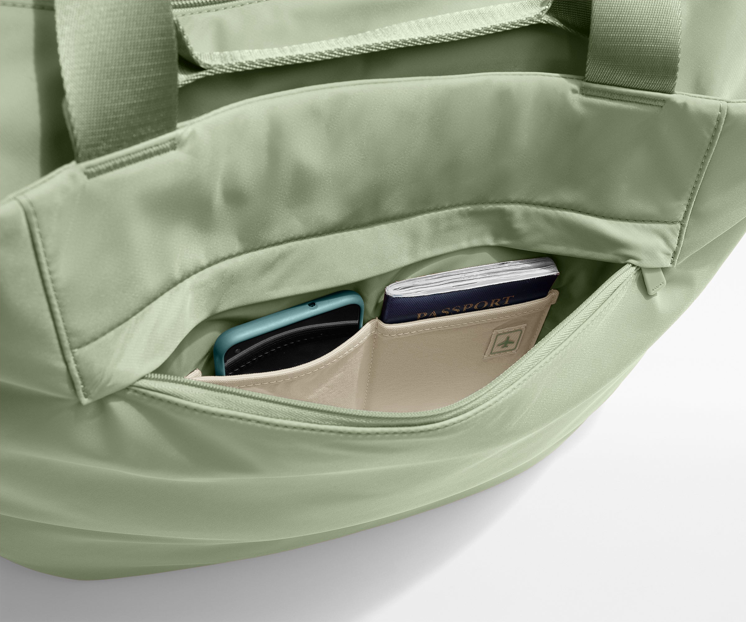 Phone and passport packed in an exterior zip pocket