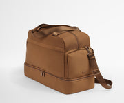 Angled view of the Featherlight Weekender showing the detachable strap and side pockets
