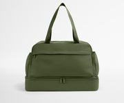 Green duffel bag on a light gray background