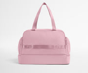 Pink duffel bag on a light gray background