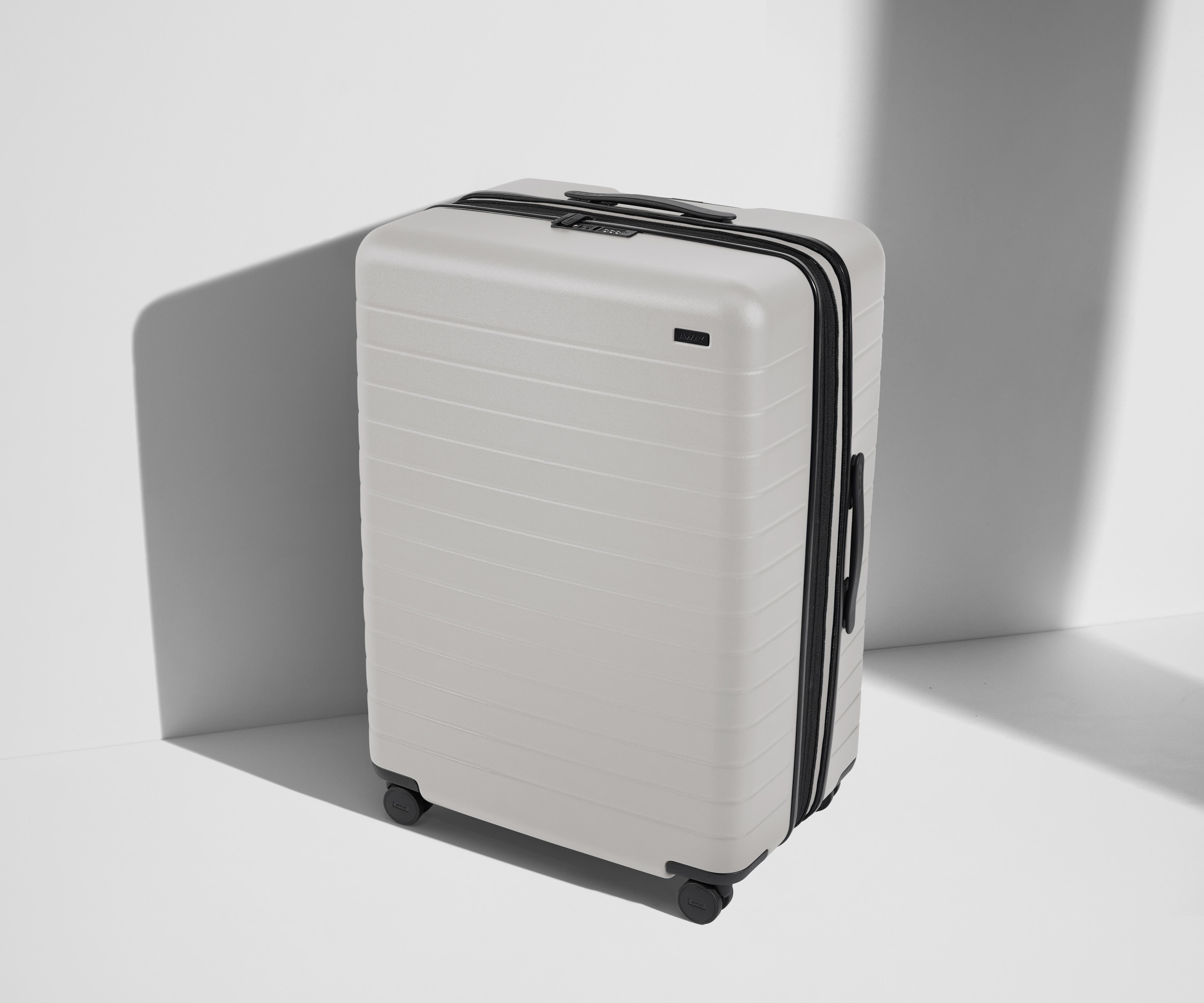 Angled product view of The Large Flex suitcase in Cloud Gray