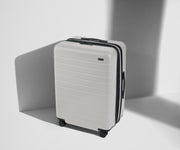 Angled product view of The Medium Flex suitcase in Cloud Gray