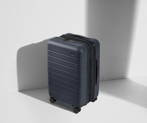 Angled product view of The Carry-On Flex suitcase in Navy Blue