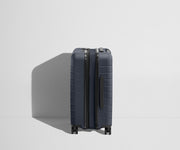 Side product view of The Carry-On Flex suitcase in Navy Blue shown fully expanded