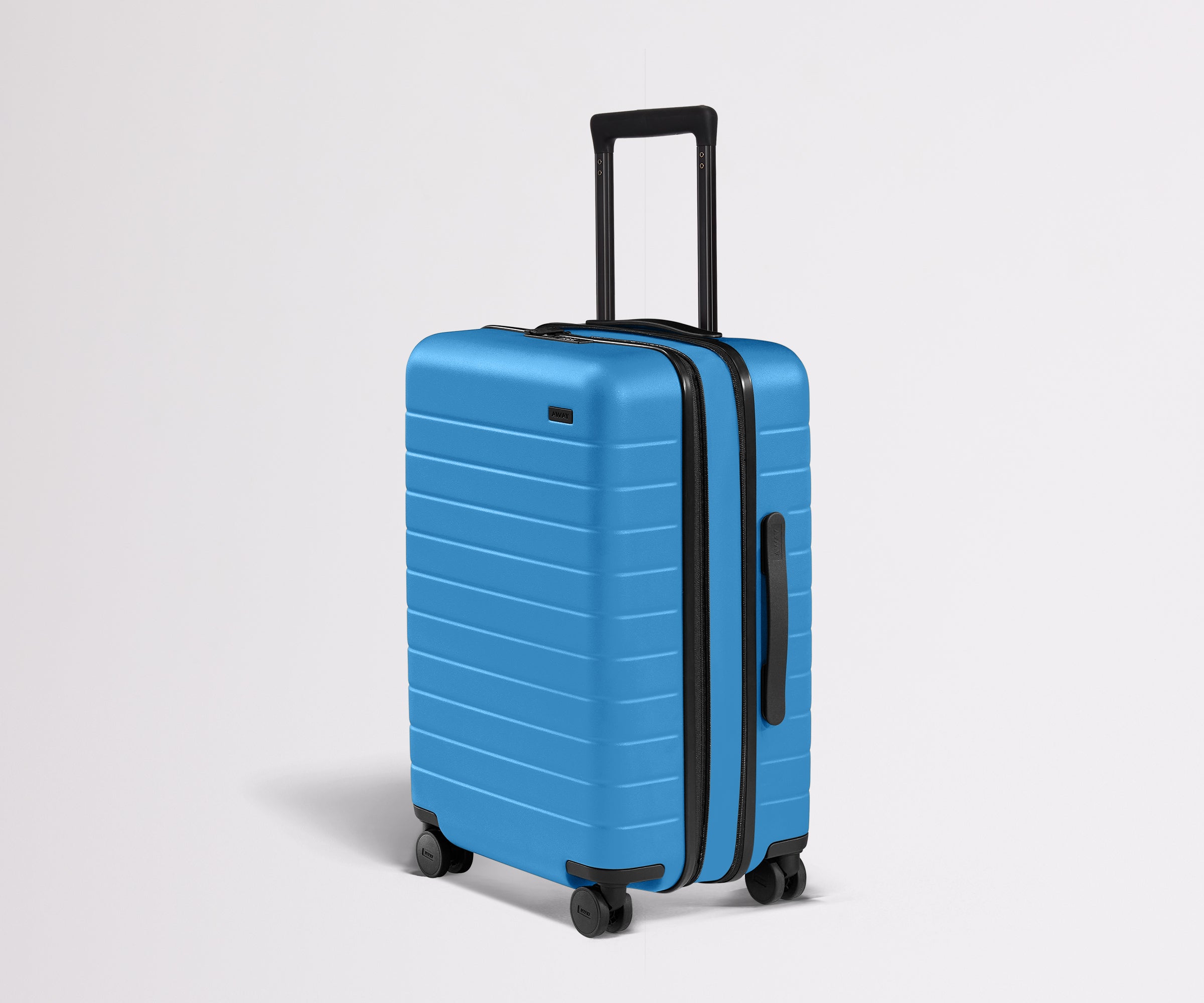 Angled product view of The Bigger Carry-On Flex suitcase in Splash Blue